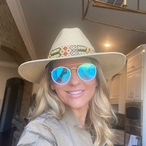 Beautiful Hat with hand beaded band around brim of hat. NWT